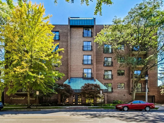 Front view of a multi-story brick residential building.