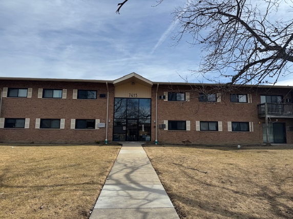 Front view of a two-story brick building.