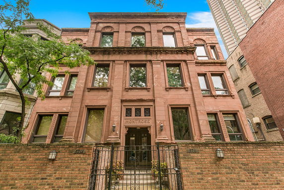 Front view of a multi-story brownstone building