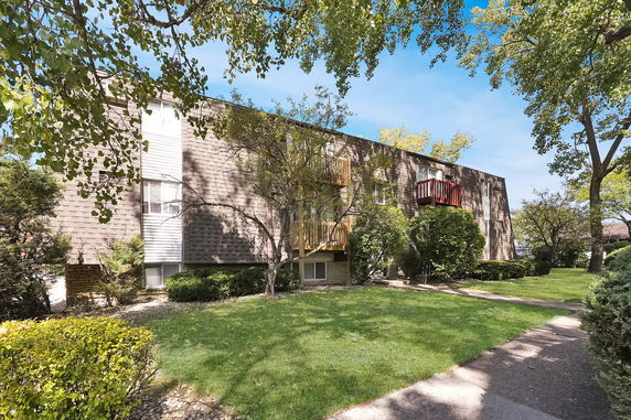 Front view of a two-story building with balconies.
