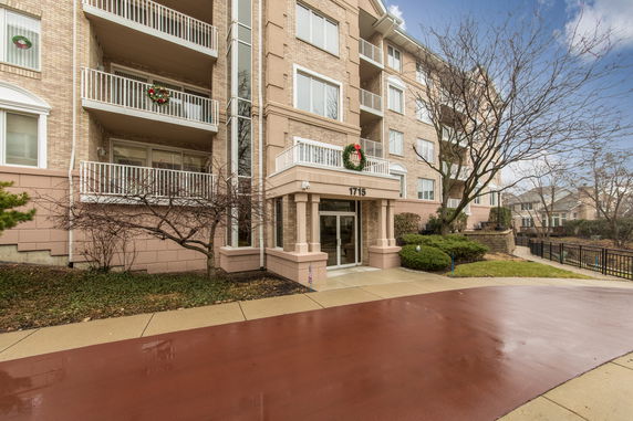 Front view of a multi-story residential building with balconies.