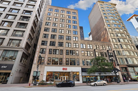 Front view of a multi-story commercial building in an urban setting.