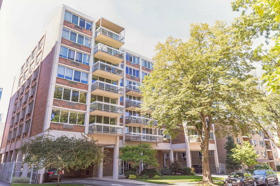 Front view of a multi-story apartment building.