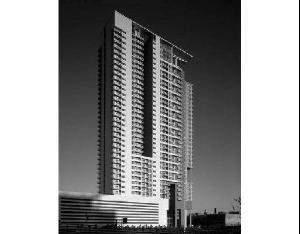 Front view of a tall modern high-rise building.