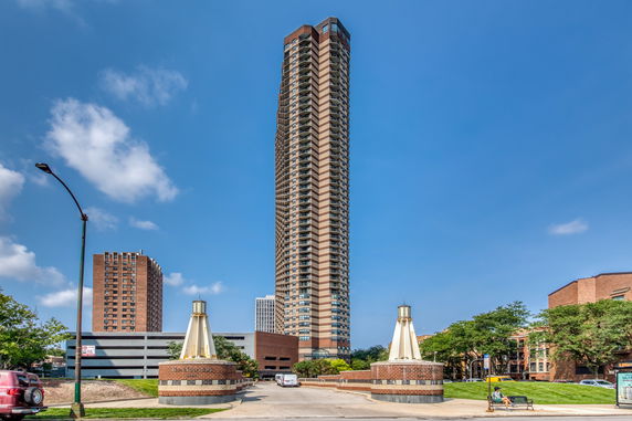 Front view of a tall residential skyscraper.