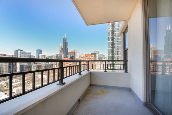 Balcony view of a city skyline with skyscrapers.