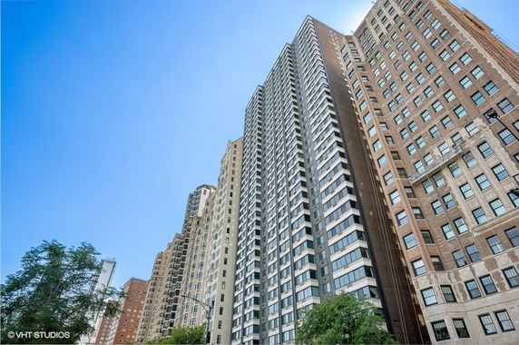 Front view of tall skyscrapers with multiple stories.