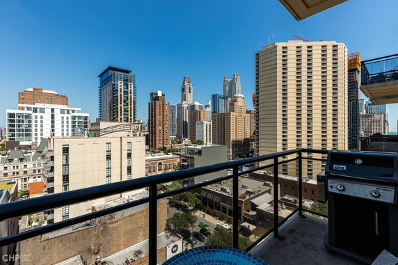 Panoramic view of a cityscape from a balcony.