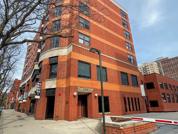Front view of a multi-story brick building.