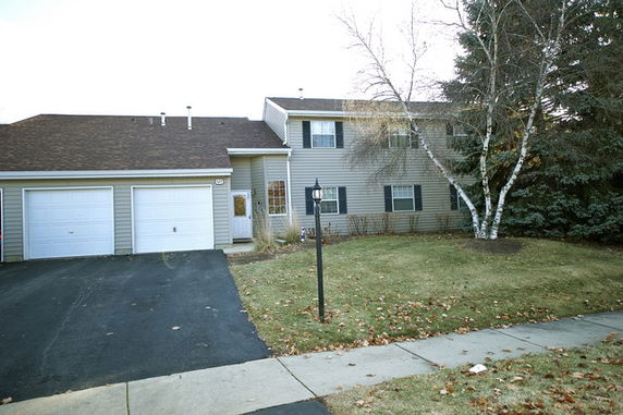 Front view of a two-story house with a double garage.