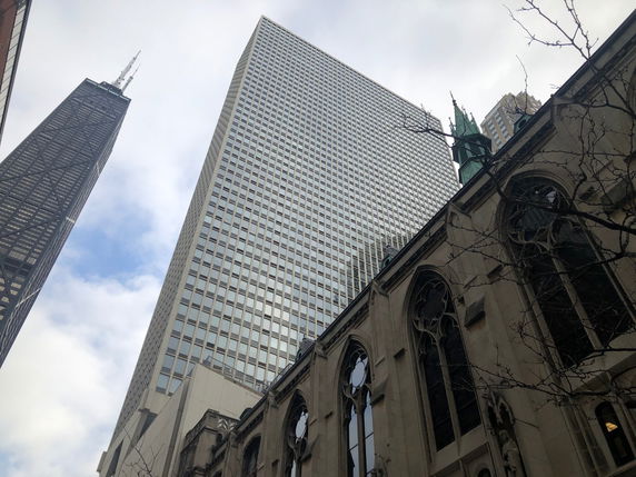 View of tall skyscrapers and an older architectural building