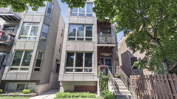 Front view of a multi-story modern townhouse.