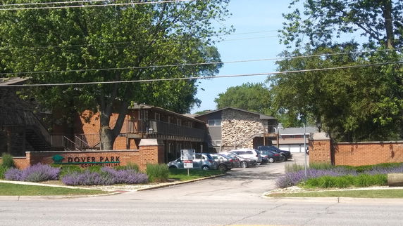 Front view of a multi-story condominium complex.