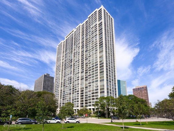 Front view of a high-rise building in an urban setting.