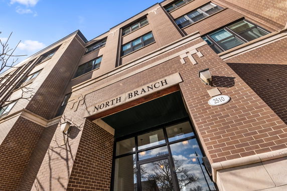 Front view of a multi-story brick building with a sign reading 'North Branch.'