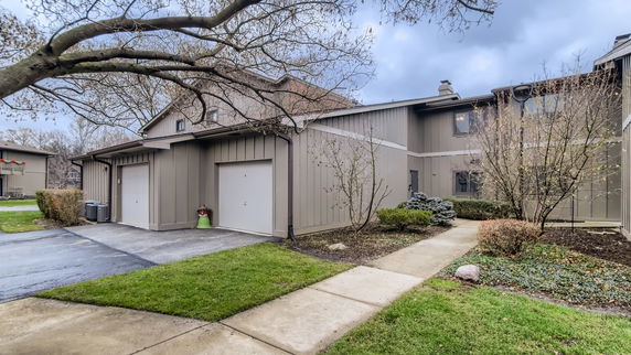 Front view of a two-story house with attached garage.