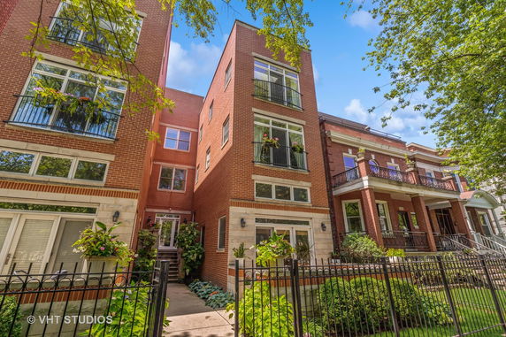 Front view of a multi-story brick residential building.
