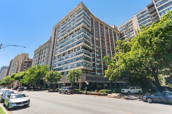 Front view of a multi-story residential building with a contemporary design.