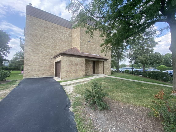 Side view of a multi-story brick building.