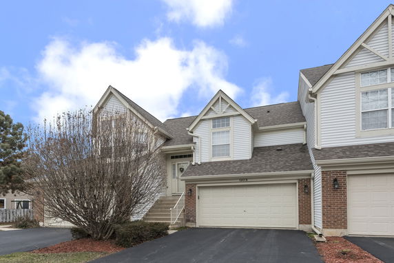 Front view of a two-story house with a double garage.
