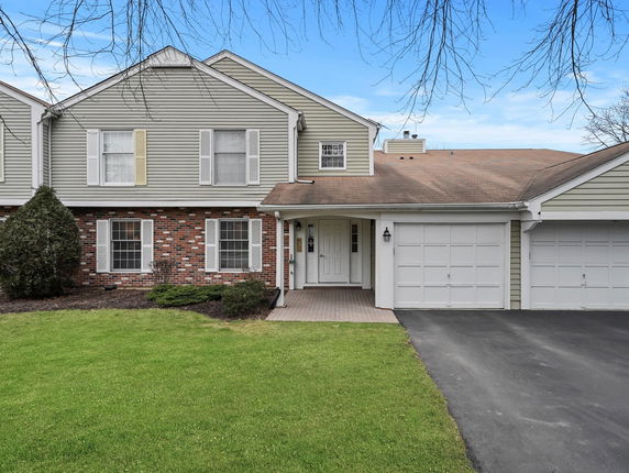 Front view of a two-story house with a double garage.