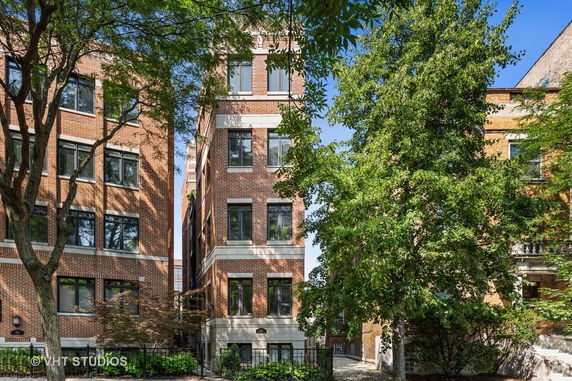 Front view of a multi-story brick residential building.