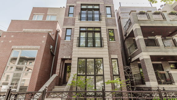 Front view of a multi-story brick building.