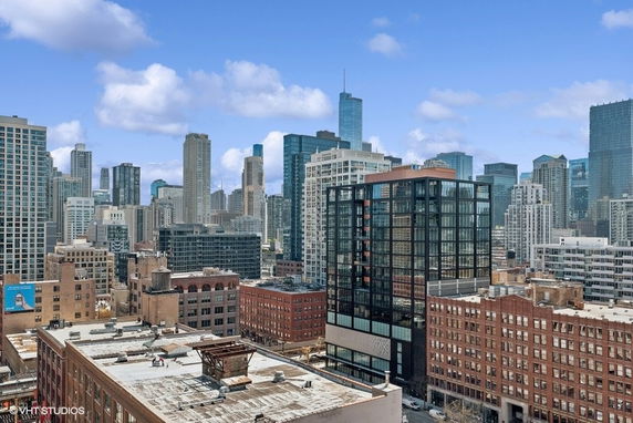 Panoramic view of a cityscape with multiple high-rise buildings.