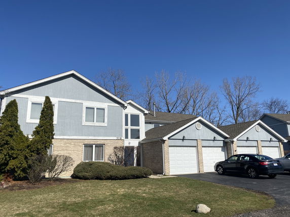 Front view of a two-story house with a double garage.