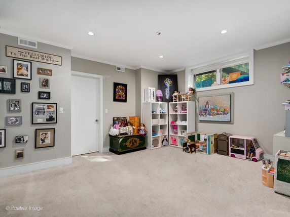 Room with toys and games set up for children to play.