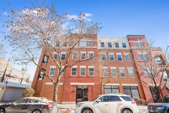 Front view of a multi-story brick building.