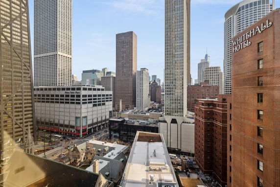 Panoramic view of a cityscape with tall buildings and skyscrapers.