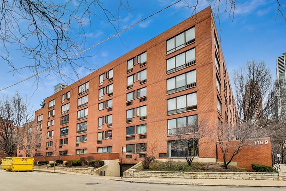 Front view of a multi-story brick building.