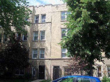 Front view of a multi-story brick building.