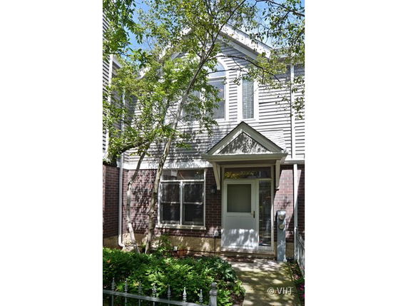 Front view of a two-story house with a small porch.