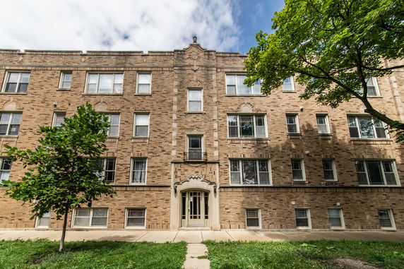 Front view of a multi-story brick building.