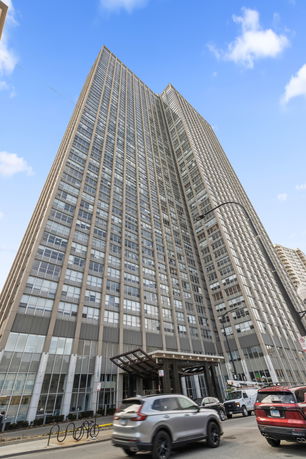 Front view of a tall multi-story building.