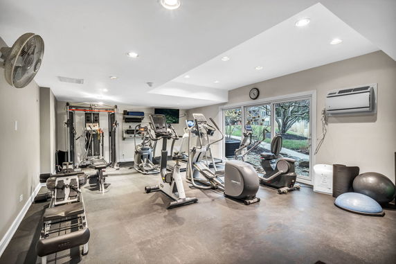Indoor gym room with various exercise equipment