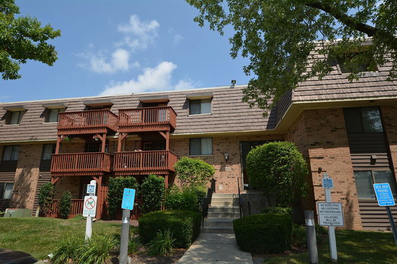 Front view of a multi-story building with balconies.