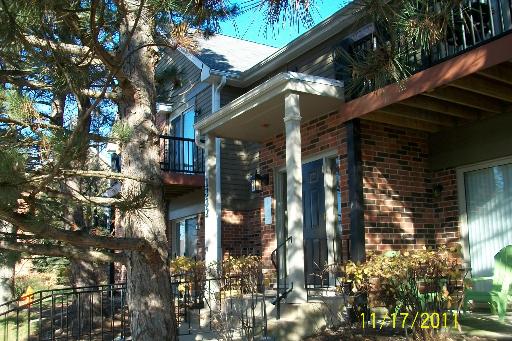 Front view of a two-story brick building with balconies.