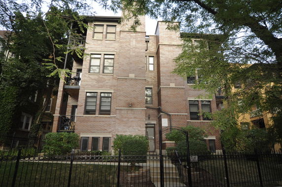 Front view of a multi-story brick apartment building