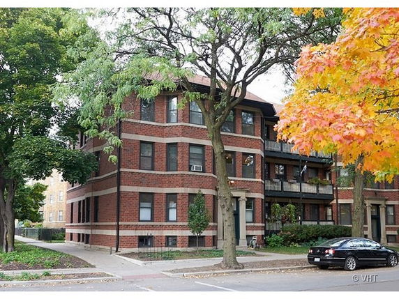 Front view of a multi-story brick building.