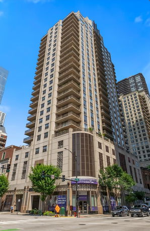 Front view of a high-rise building with a modern architectural design.
