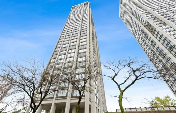 Front view of a high-rise building with numerous windows.