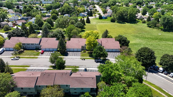 Panoramic view of residential houses surrounded by greenery.