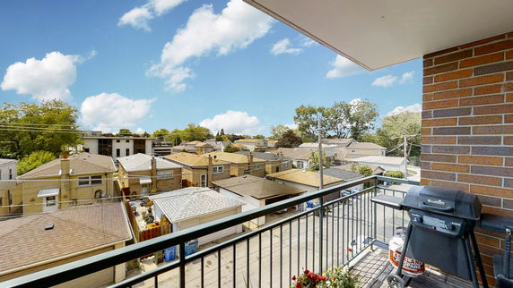 View of surrounding residential area from a balcony.