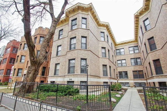 Front view of a multi-story brick building.