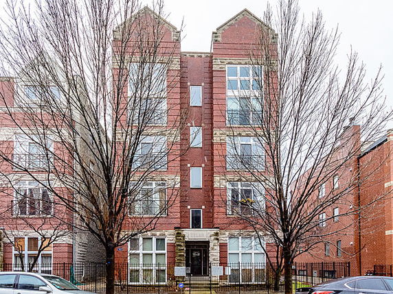 Front view of a multi-story brick building.