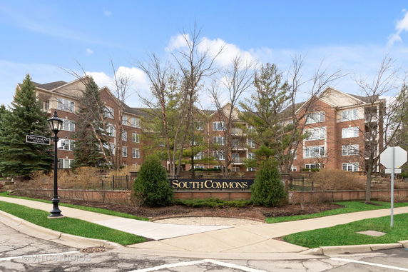 Front view of a multi-story brick building named 'South Commons'.