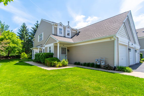 Front view of a two-story house with attached garage.
